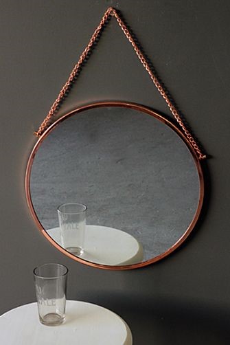 round metallic mirror in copper for design trends in bristol new builds